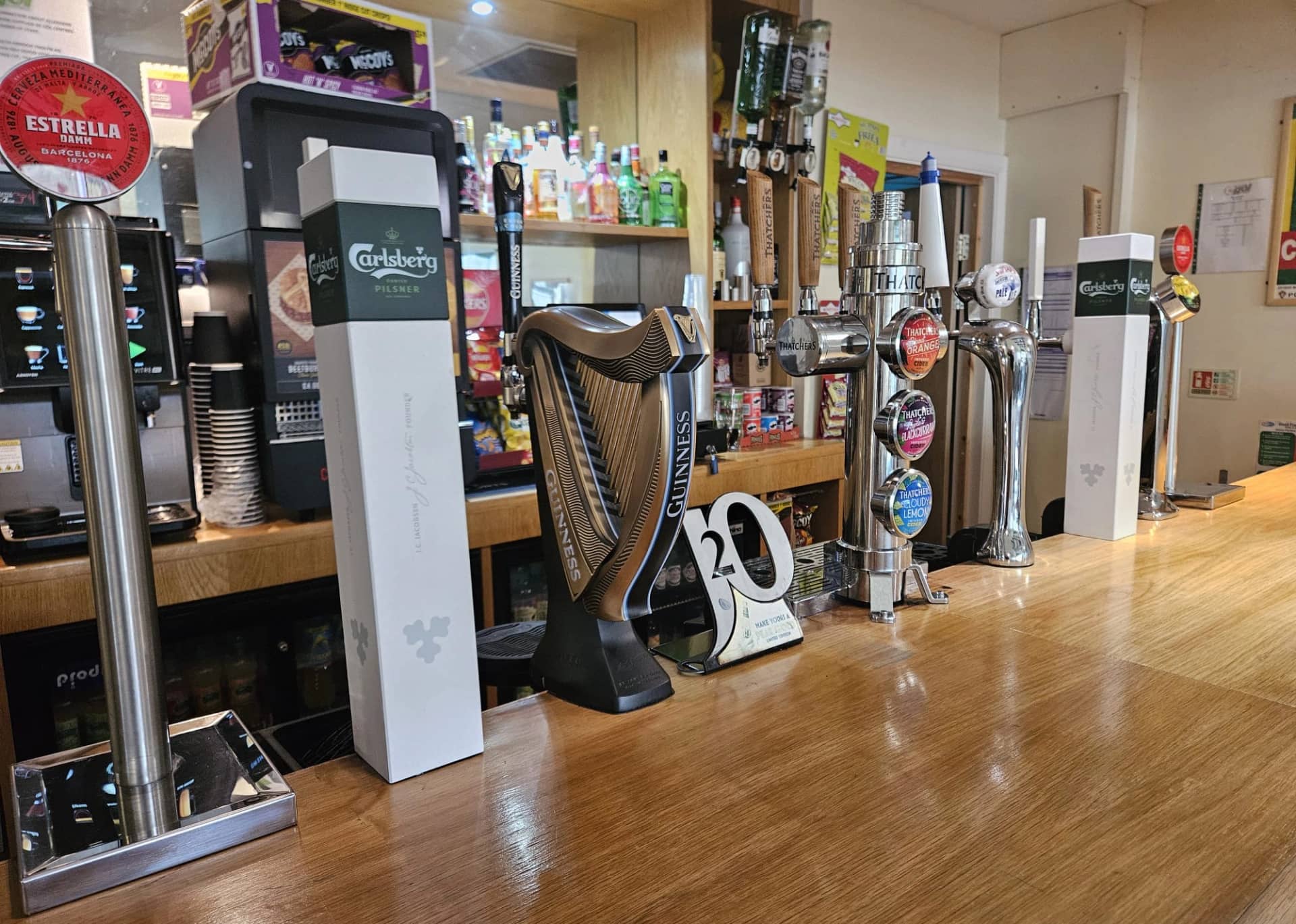 Timber clubhouse bar with draught taps, spirits and drinks equipment