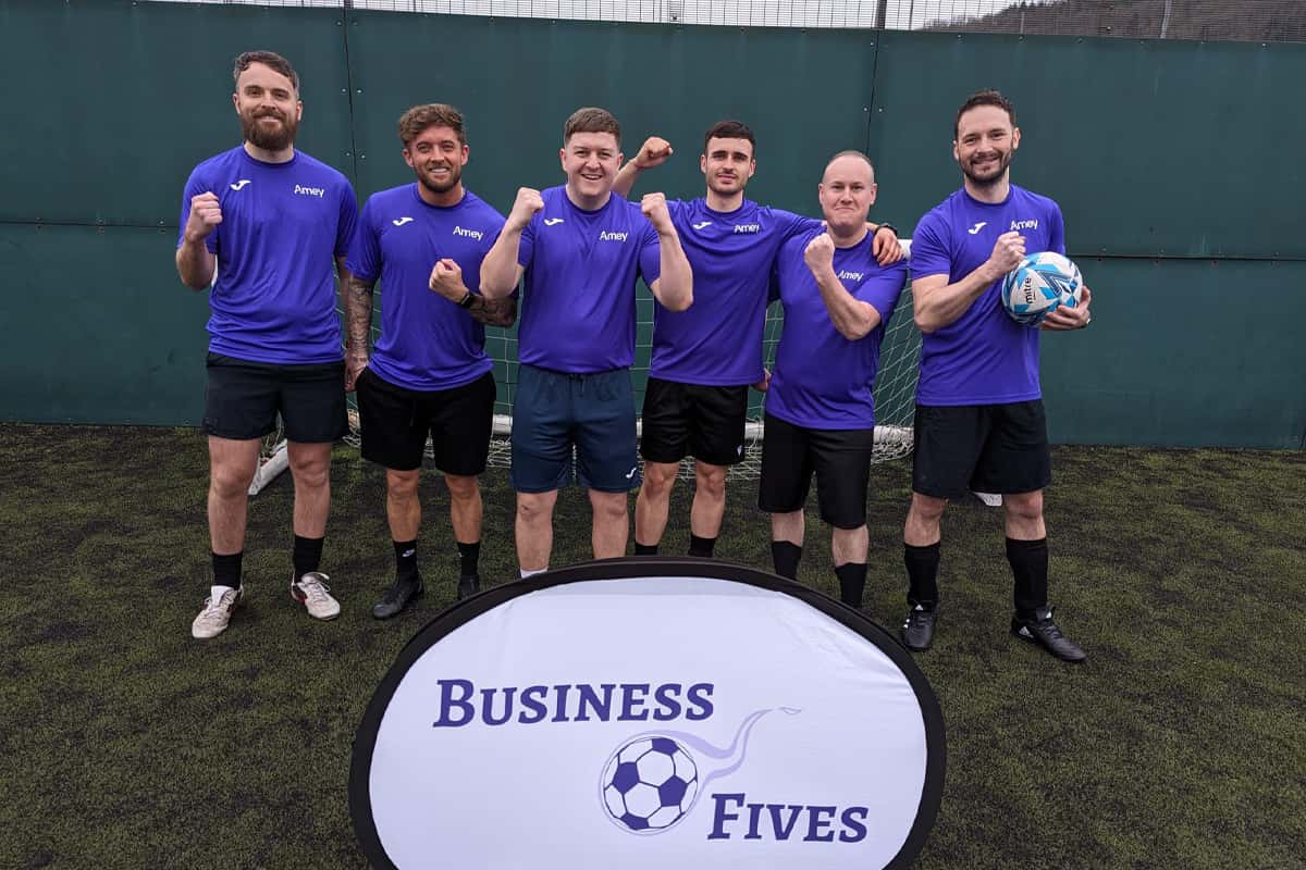 Corporate team celebrating at a 5-a-side tournament at Gôl Centres Cardiff