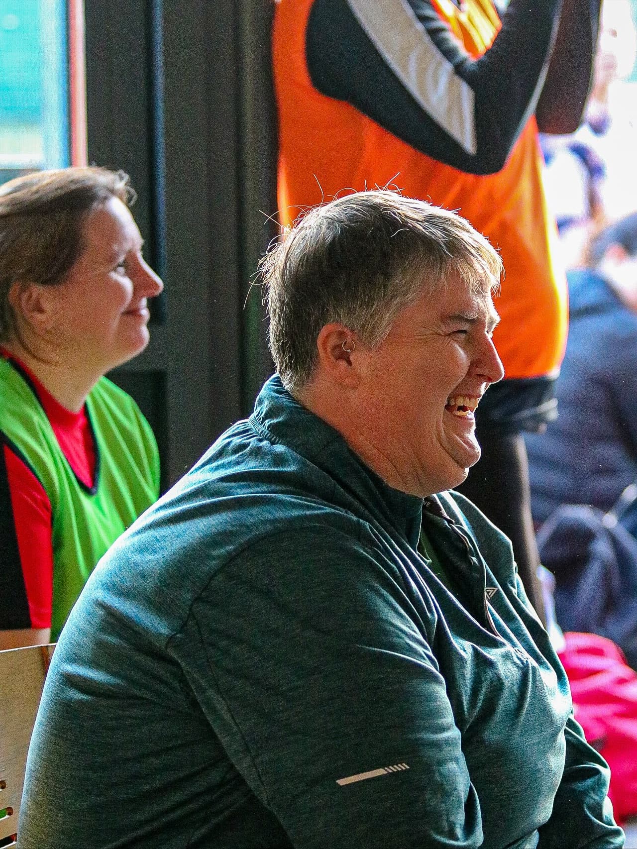 Two participants sharing a laugh pitch-side during the tournament