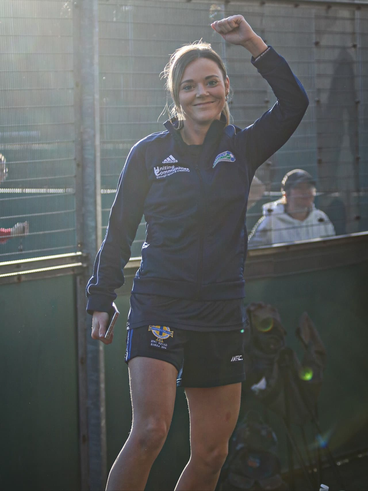 A Street Soccer Northern Ireland player celebrating with a raised fist